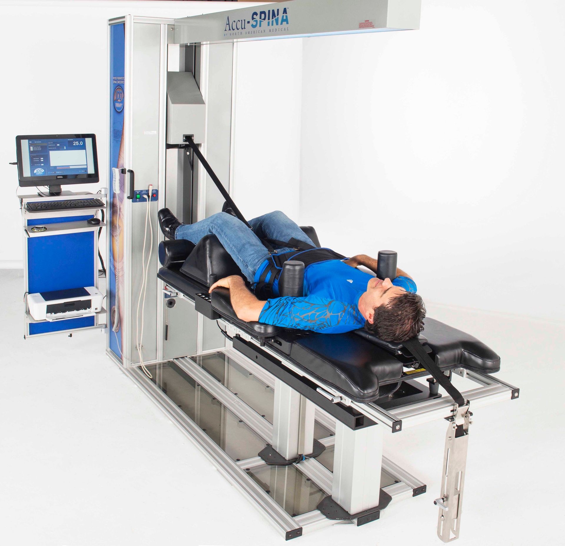 Man receiving spinal decompression therapy on an Accu-SPINA machine.
