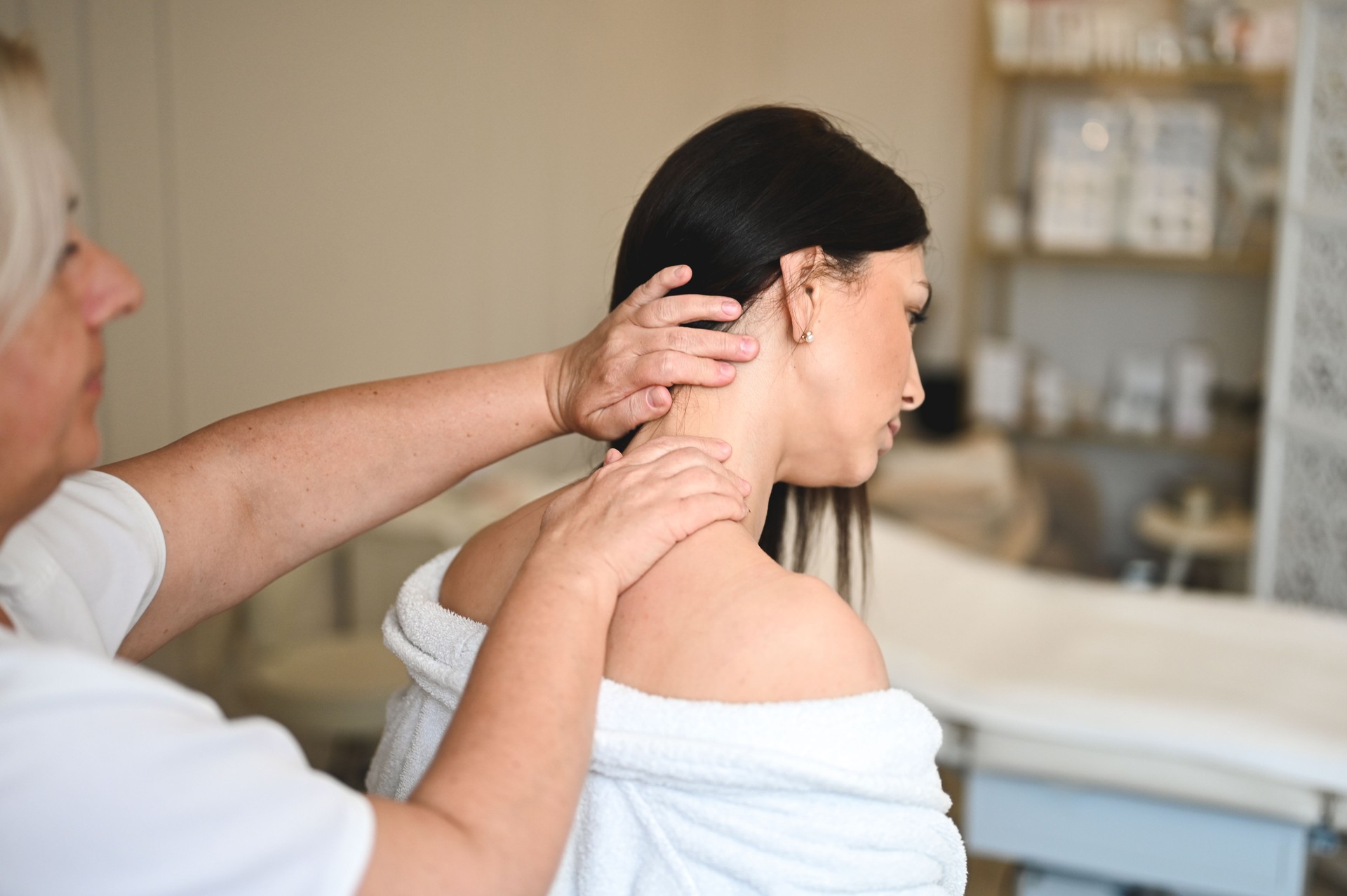 Neck massage at spa center.